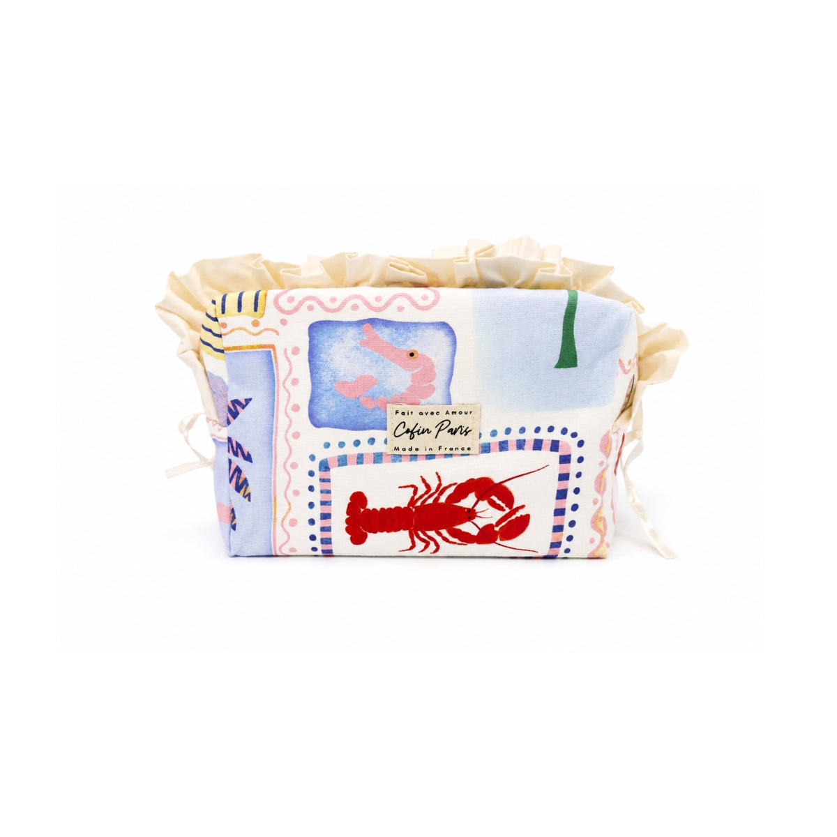 Front view of the Cofin Paris Medium Paola Riviera toiletry bag featuring a cotton Riviera print with lobster, shrimp, and cream ruffled trim.