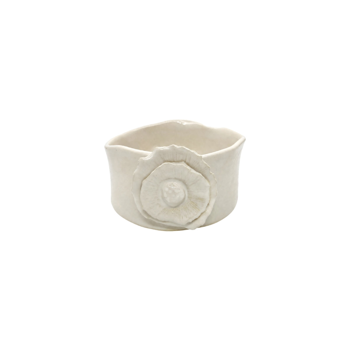 Front view of Nayla's Ceramics white wavy round ceramic bowl showing the sculpted floral accent