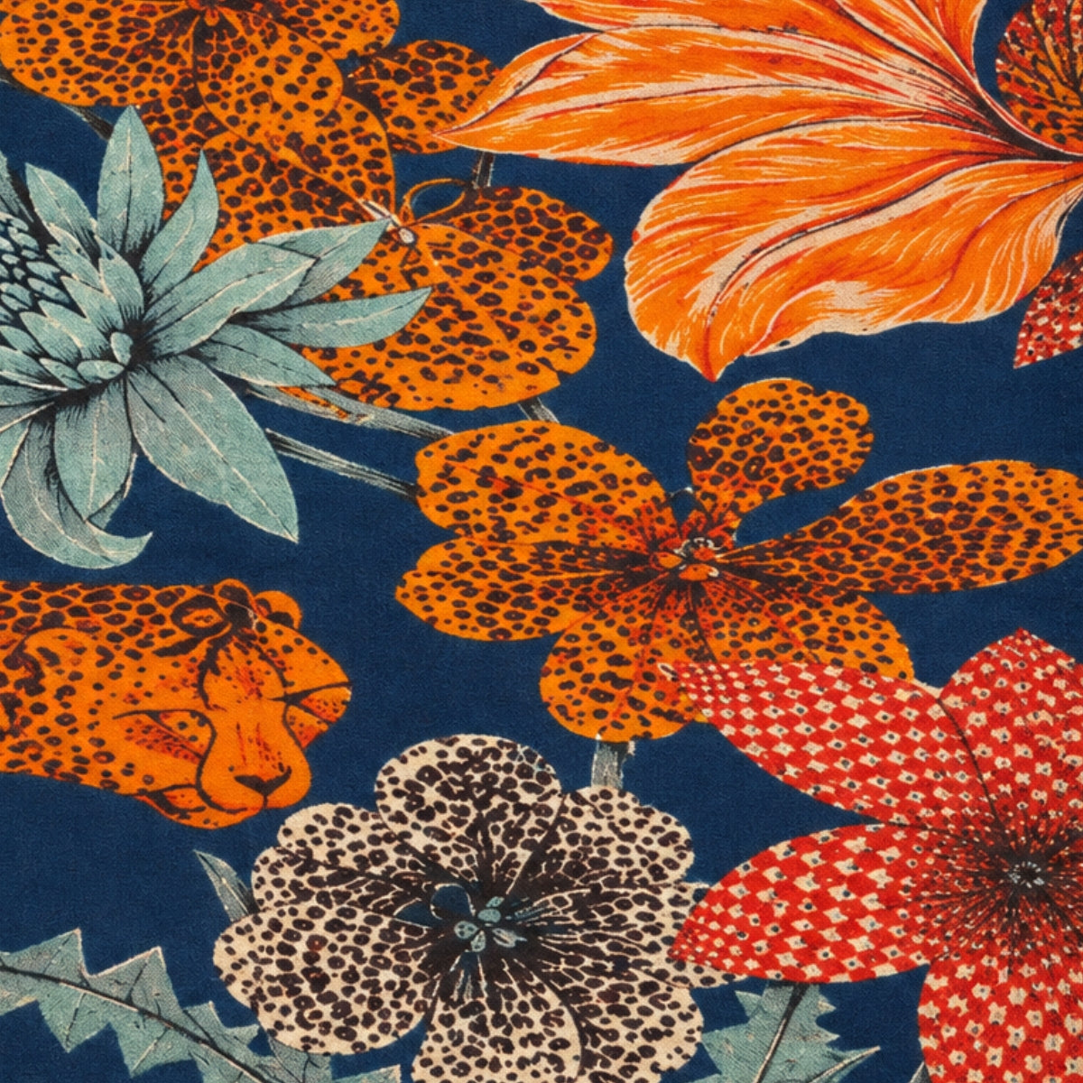 Close-up of the scarf's floral cluster in coral, cream, and dusty teal against the navy ground