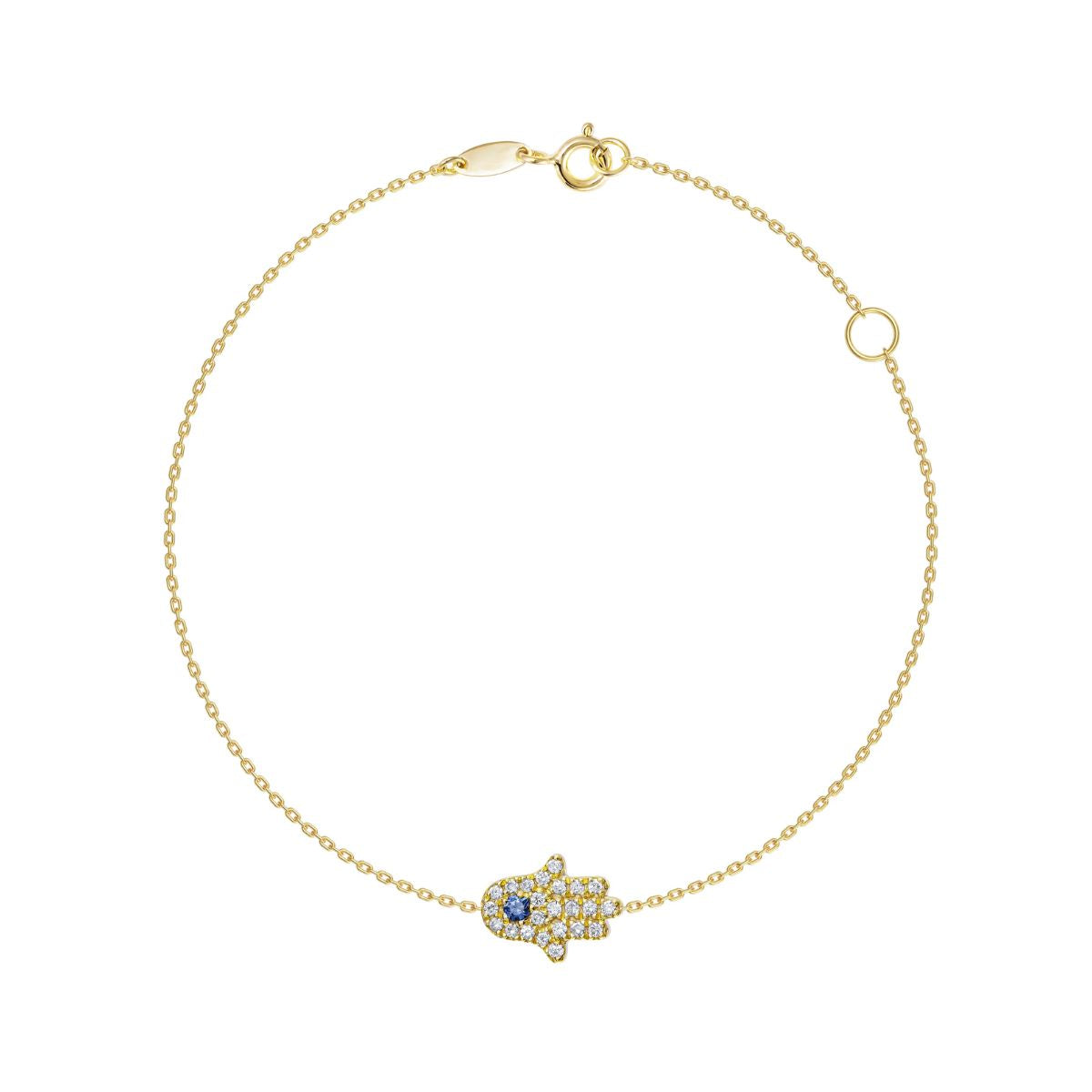 A delicate gold chain bracelet with a Hamsa hand charm paved with small clear stones and featuring a central blue gemstone, shown on a plain white background.