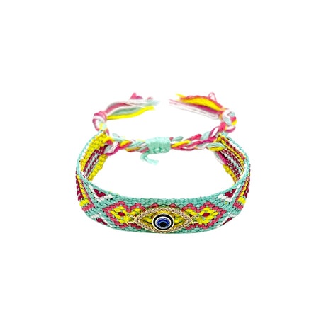 Woven friendship bracelet in mint yellow and pink floral pattern with blue enamel evil eye charm and crystal detail, adjustable pull cord closure