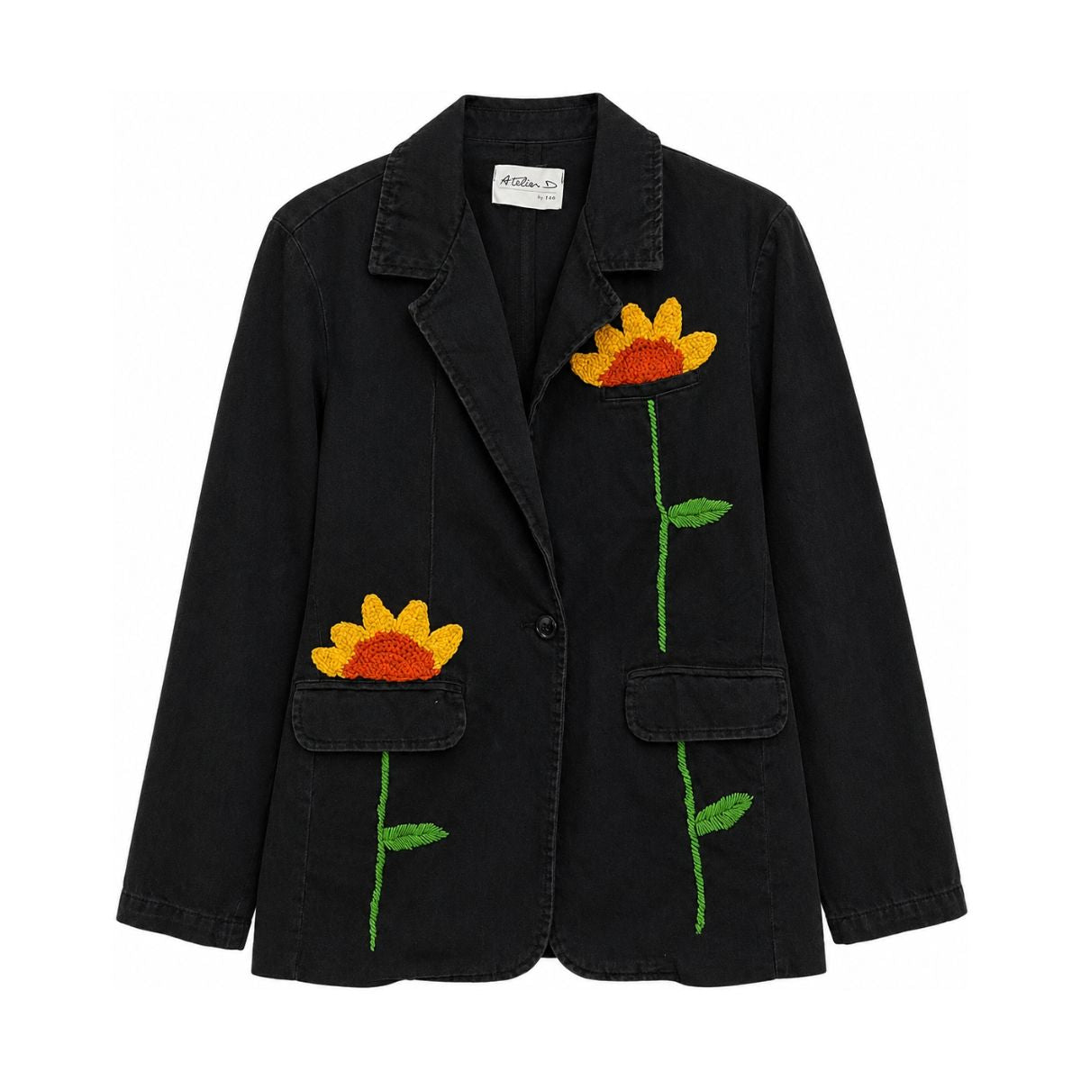 Flat front view of the Boutique Flo Sunflower Bloom Embroidered Black Jacket, showing hand-embroidered sunflowers with green stems across the black denim, notched lapel collar, and flap pockets