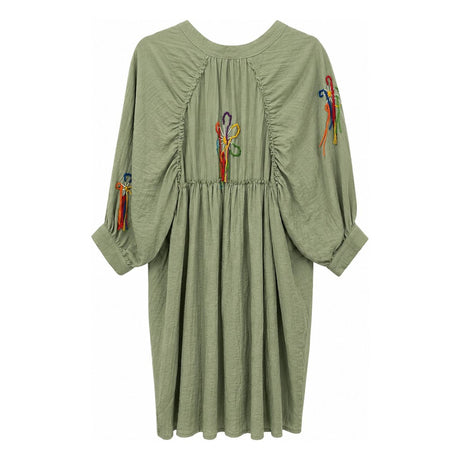 Flat back view of the Boutique Flo Wildflower Embroidered Green Shirt Dress, showing the gathered back panel and longer curved hem in sage green