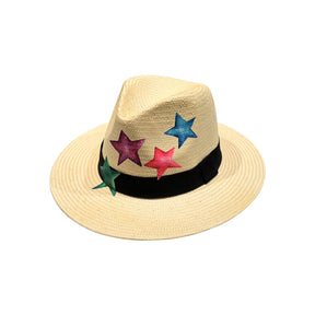 Front view of the City Girl Hand-Painted Colored Stars Wide Rim Hat, showcasing the natural woven straw crown with hand-painted stars in blue, magenta, pink, and green above a black grosgrain band