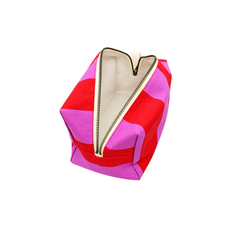 Open top view of the Large Paola Striped toiletry bag displaying the spacious interior with a waterproof lining.