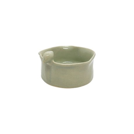 Angled view showing the interior and delicate bird accent of Nayla's Ceramics light green ceramic food serving bowl
