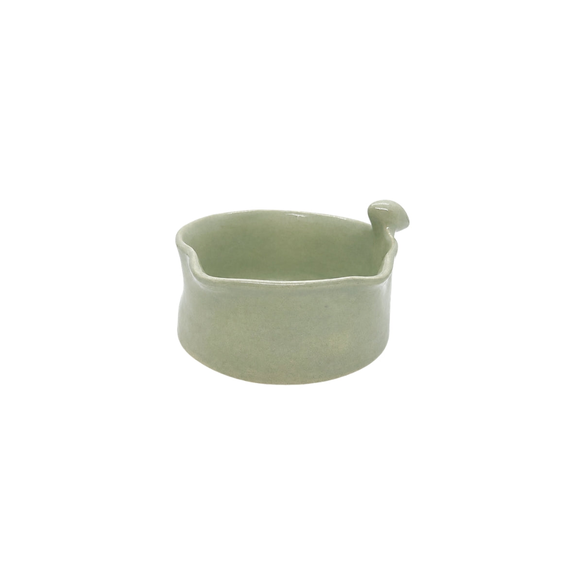 Side view showcasing the organic wavy rim and smooth glaze of Nayla's Ceramics light green birdie bowl