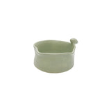 Side view showcasing the organic wavy rim and smooth glaze of Nayla's Ceramics light green birdie bowl