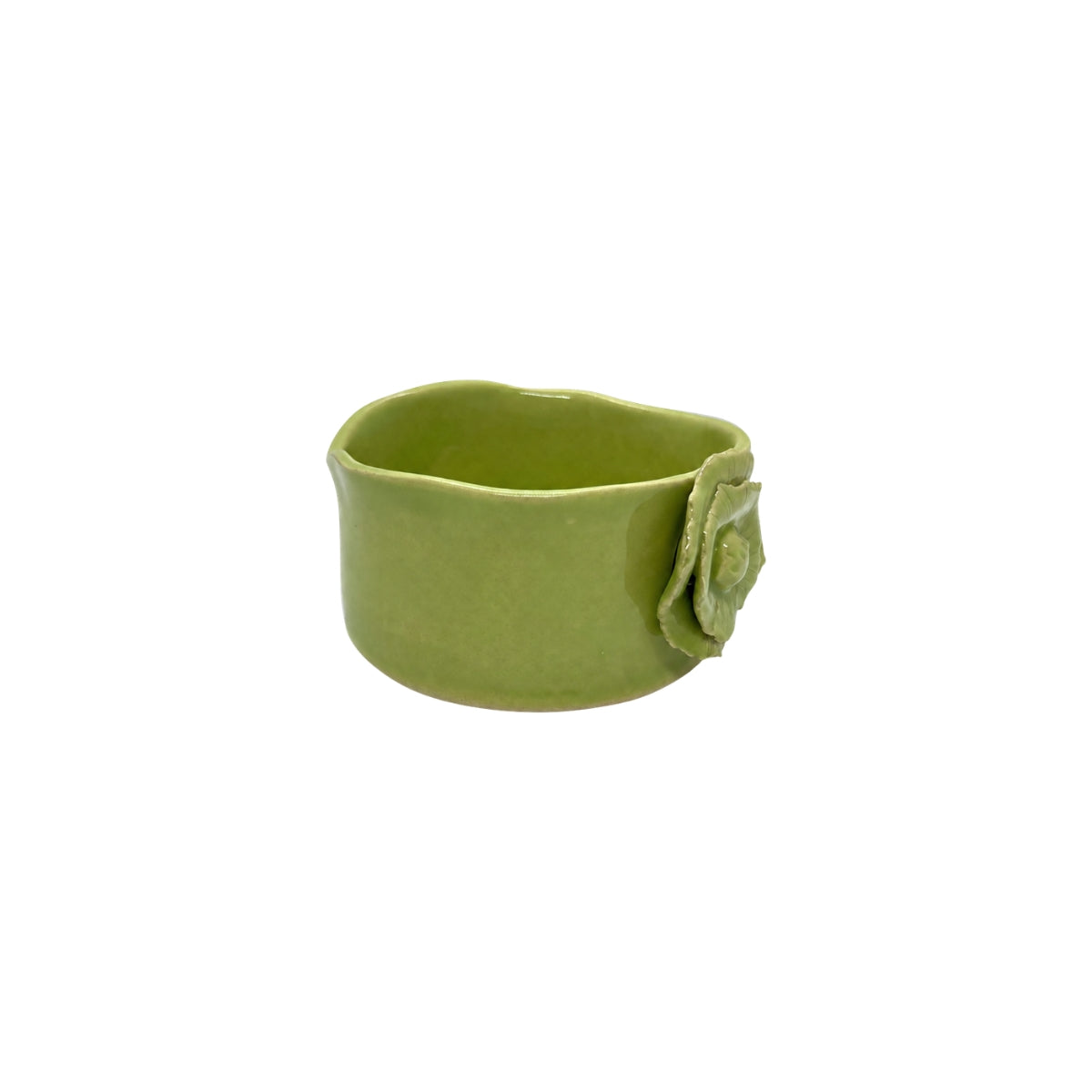 Angled view of Nayla's Ceramics lime green wavy round ceramic bowl highlighting the interior depth and sculpted flower accent
