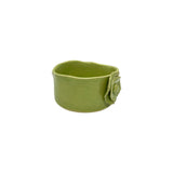 Angled view of Nayla's Ceramics lime green wavy round ceramic bowl highlighting the interior depth and sculpted flower accent