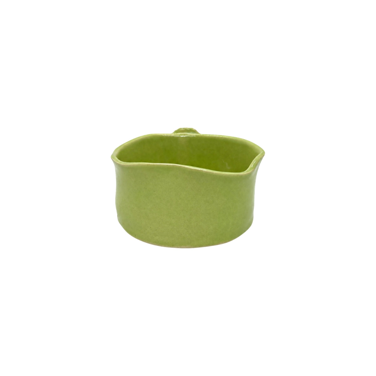 Back view of Nayla's Ceramics lime green wavy round ceramic bowl showing the handcrafted glaze finish