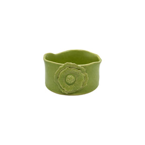 Front view of Nayla's Ceramics lime green wavy round ceramic bowl showing the multi-layered floral detail