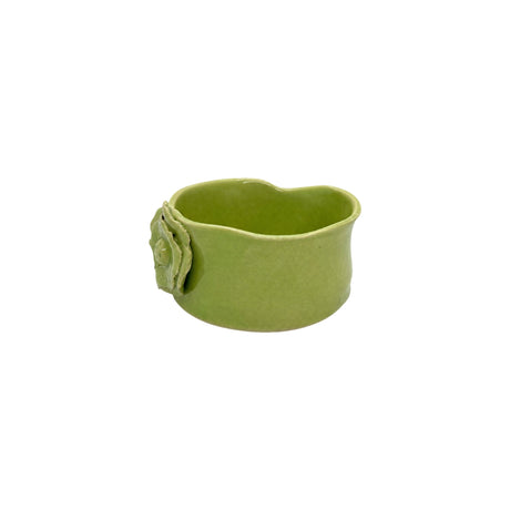Side profile of lime green ceramic bowl by Nayla's Ceramics showcasing the organic wavy rim design