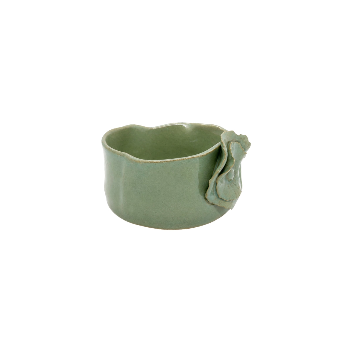Three-quarter angle of Nayla's Ceramics old green wavy bowl highlighting the interior opening and sculpted floral motif
