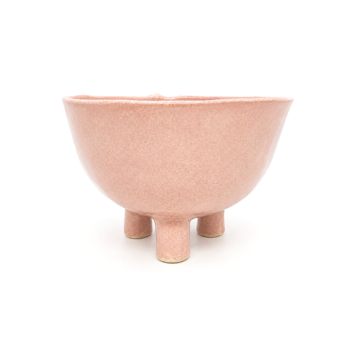 Back view of blush pink footed glaze handmade pottery bowl on three legs by Nayla's Ceramics