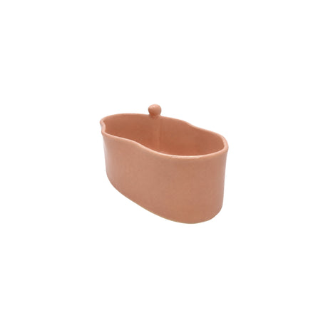 Angled view showing the interior and bird accent of Nayla's Ceramics pink ceramic oval snack bowl