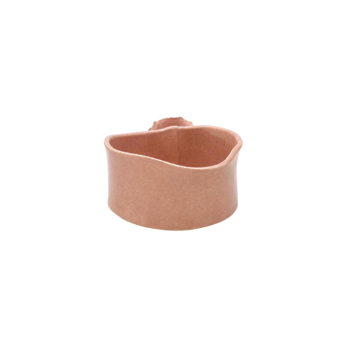 Back view of soft pink wavy round ceramic bowl by Nayla's Ceramics highlighting hand-molded form