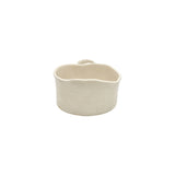Back view of soft white wavy ceramic bowl by Nayla's Ceramics demonstrating hand-molded form