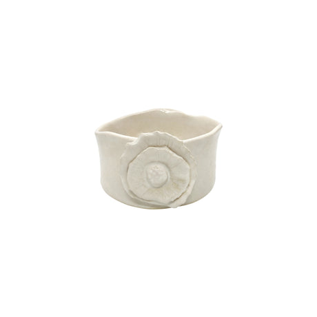 Front view of Nayla's Ceramics white wavy round ceramic bowl showing the sculpted floral accent