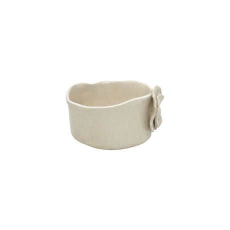 Three-quarter view of Nayla's Ceramics white wavy ceramic bowl showing interior basin and layered petal applique