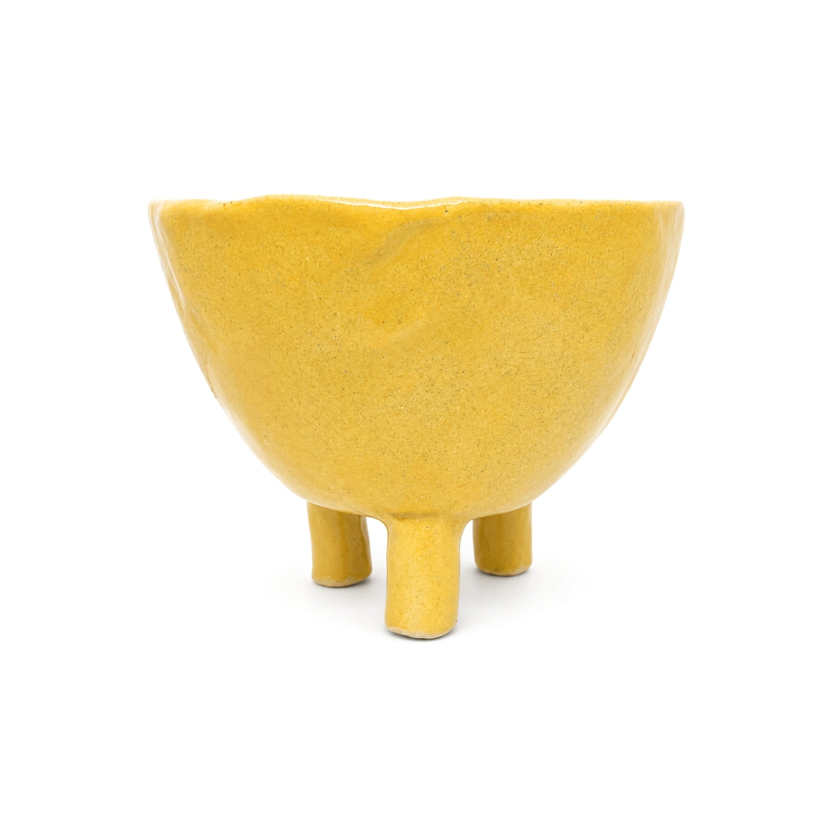 Back view of yellow footed glaze handmade pottery bowl on three legs by Nayla's Ceramics