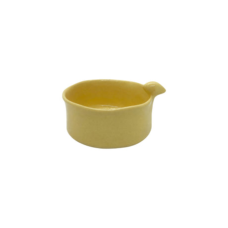 Side view showcasing the organic wavy rim and smooth yellow glaze of Nayla's Ceramics birdie bowl