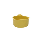 Back view of Nayla's Ceramics warm yellow wavy ceramic bowl highlighting the handcrafted shape