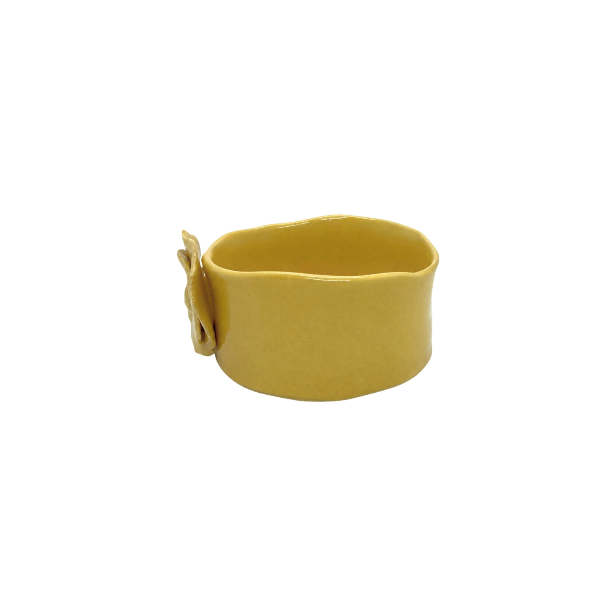 Side view of mustard yellow handcrafted ceramic dish by Nayla's Ceramics showing the organic rim contour