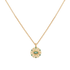 Orchid Jewelry 18k yellow gold pendant necklace featuring a circular pave diamond and emerald sunburst eye medallion