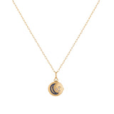 Orchid Jewelry 18k yellow gold circular locket necklace featuring a sapphire crescent moon and diamond stars on a paperclip chain