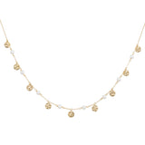 Orchid Jewelry 18k yellow gold choker featuring station pearl beads and dangling hammered gold disc charms