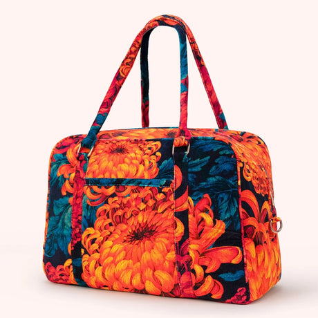 Front view of the chrysanthemum print velvet weekend bag, showing the full floral pattern and structured shape