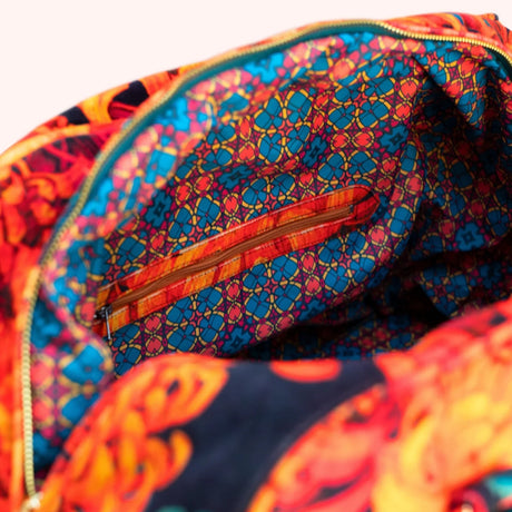 Close-up of the weekend bag's interior zip pocket against the kaleidoscope print lining