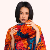 Model holding the chrysanthemum print quilted velvet washbag against the matching kimono print