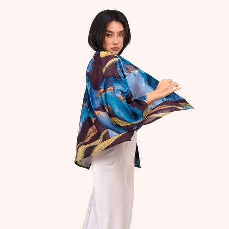 Side view of the plum iris print kimono jacket, showing the wide sleeve drape and open front silhouette