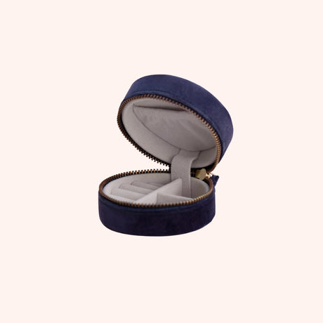 Interior view of the navy floral hedgerow jewelry box, showing the grey lining, ring slot, and compartments