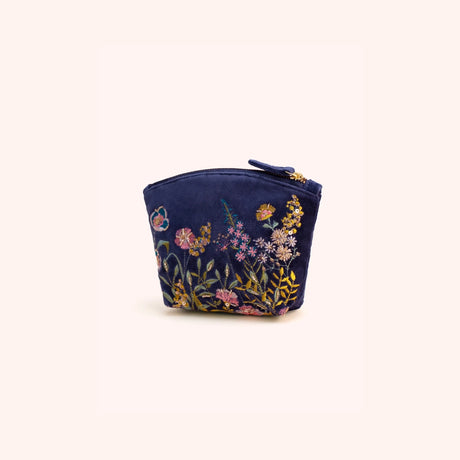 Navy velvet mini pouch hand embroidered with a pink, gold, and blue floral hedgerow motif