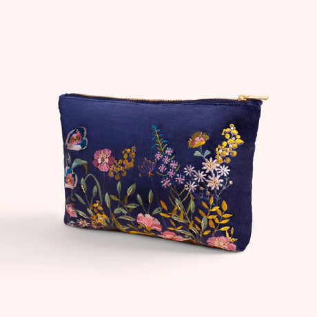 Navy velvet zip pouch hand embroidered with a pink, gold, and blue floral hedgerow motif