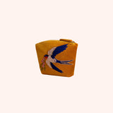 Mustard velvet mini pouch hand embroidered and beaded with a swallow in flight carrying pink blossoms