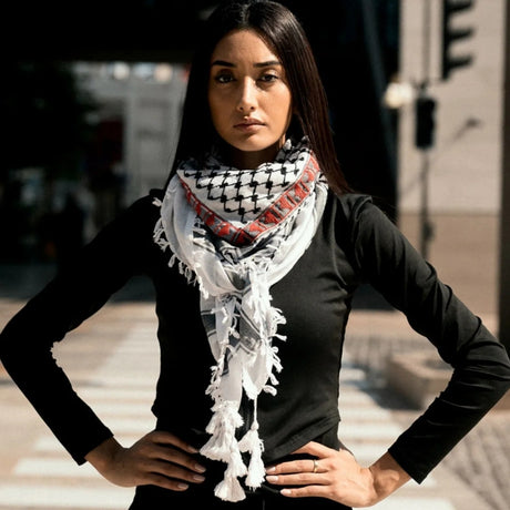 Back view of model wearing SEP black and white cotton keffiyeh scarf styled as a full headwrap