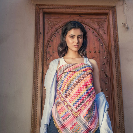 Front view portrait of model wearing SEP pink multicolor keffiyeh scarf wrapped as a top