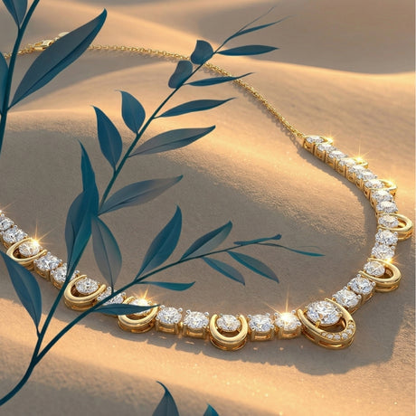 14k yellow gold necklace with graduated round lab-grown diamonds laid on sand with desert foliage, fine jewelry lifestyle styling