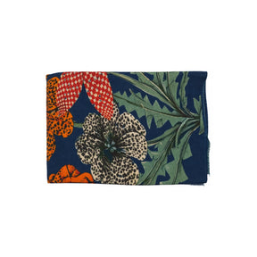 Navy cashmere scarf folded, showing the orange cheetah print alongside coral and cream exotic florals