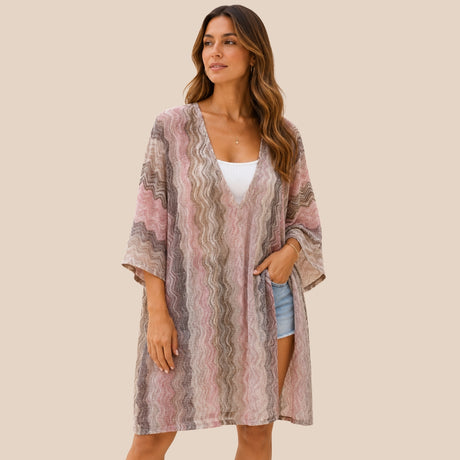 Front view of model wearing You & Eye mauve chevron knit short kaftan cover-up over denim shorts and white top