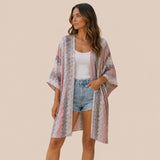 Front view of model wearing You & Eye soft mauve chevron open-knit short kimono styled over denim shorts and white tank top