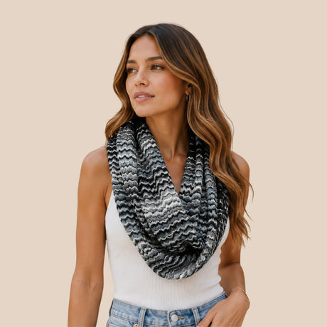 Front view of model wearing You & Eye black and white monochrome chevron knit snood infinity scarf draped over a white tank top