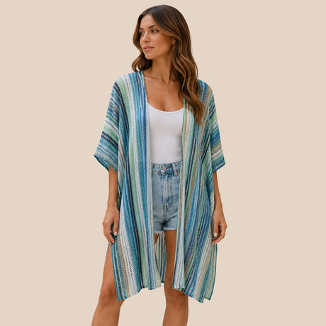 Front view of model wearing You & Eye blue ocean stripe open-knit short kimono styled over denim shorts and white top