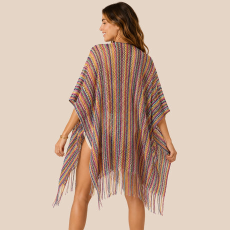 Back view of You & Eye colorful open-side rainbow crochet short poncho cover-up showing open side slit drape and fringe trim